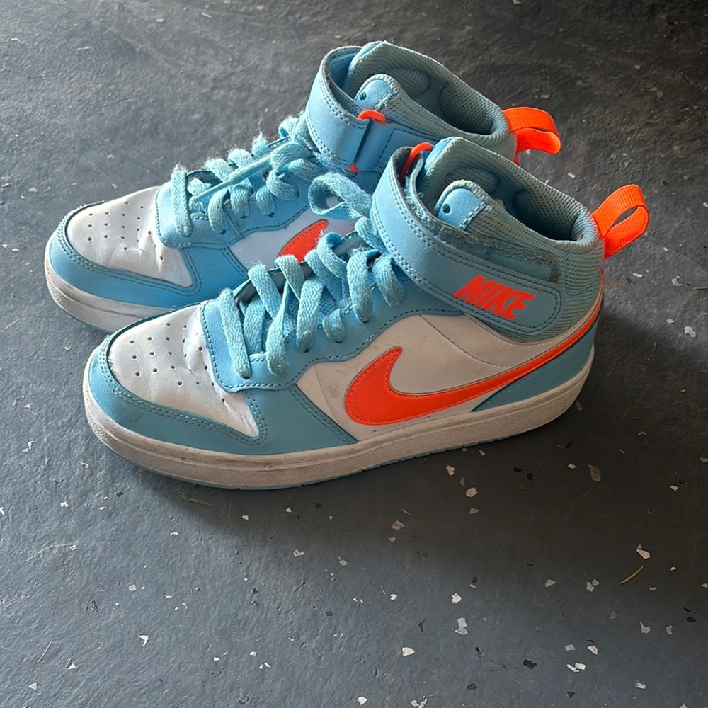 Nike Blue and Orange Sneakers with Classic Low-Top Design